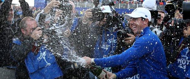 Rory McIlroy celebrates Europe winning the Ryder Cup as he sprays champagne after the Singles Matches