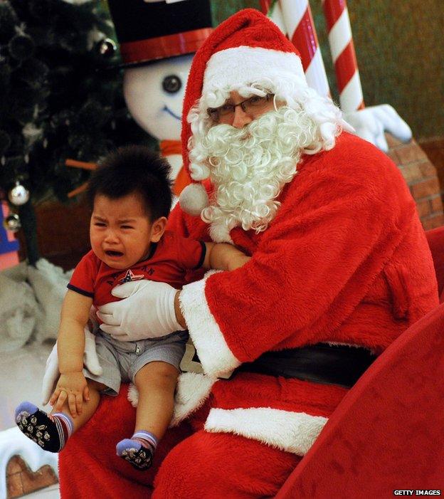 Santa with crying child