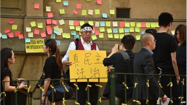 Supporters of the thousands of protesters who paralysed parts of Hong Kong to demand greater democracy from Beijing gather in Sydney on 29 September 2014.