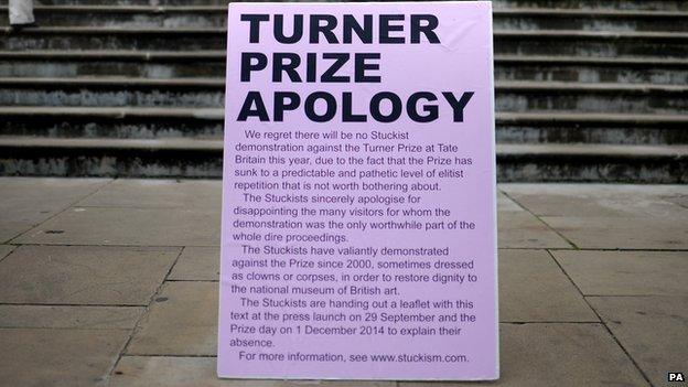 A sign from the Stuckist protest group outside Tate Britain during the press preview of the Turner Prize exhibition