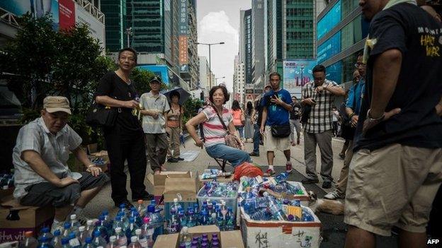 Supporters of pro-democracy demonstrators provide free drinking water in the Mongkok district of Hong Kong on 30 September 2014