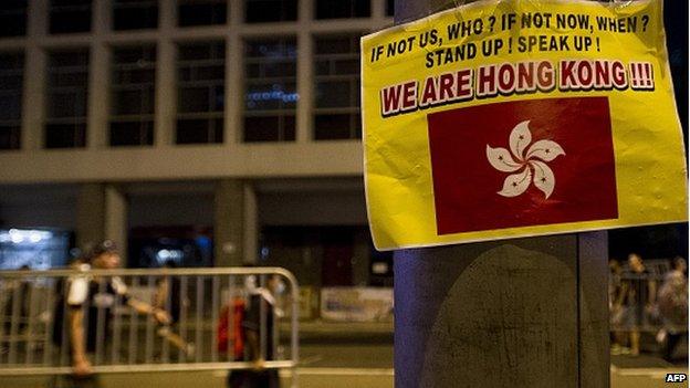 A sign is displayed during a pro-democracy protest in the Central district of Hong Kong on 30 September 2014.