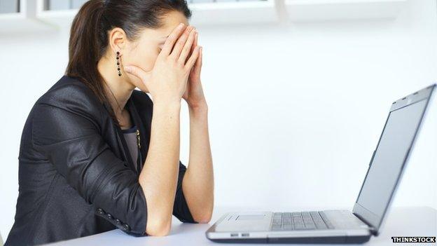 Woman at a computer (pic posed by model)