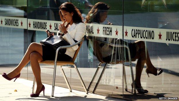 Woman on phone at cafe