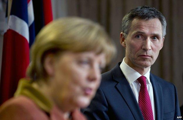 Norwegian Prime Minister Jens Stoltenberg (R) with German Chancellor Angela Merkel in Oslo, 20 February 2013