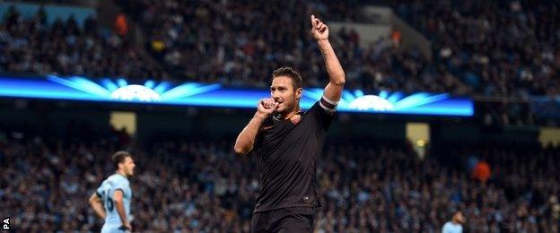 Francesco Totti celebrates his equaliser against Manchester City