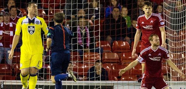 Mark Reynolds (right) is left dejected after giving away the late penalty that allowed St Mirren to snatch a point