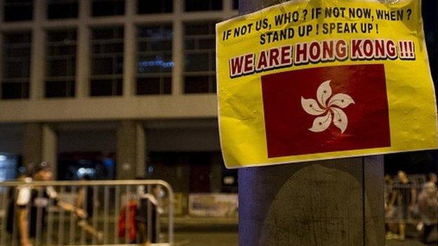 A sign is displayed during a pro-democracy protest in the Central district of Hong Kong on 30 September 2014.