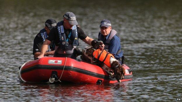 Police officers search for Alice Gross