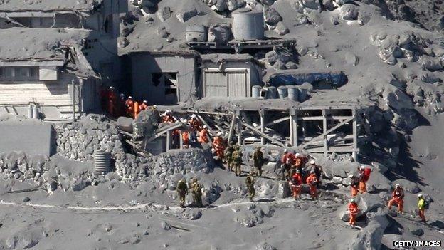 Rescue workers search for missing bodies after Mount Ontake eruption on 28 Sept