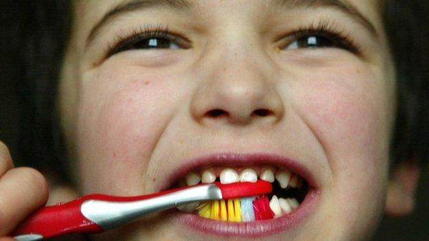 Boy brushing teeth