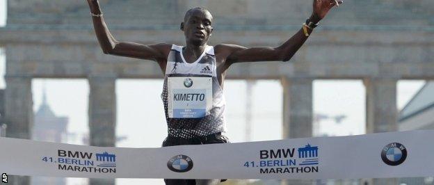 Kimetto crosses the finish line in a new men's record time over the marathon distance