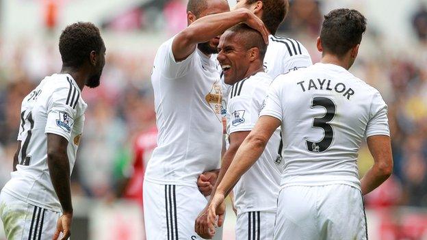 Swansea City celebrate a goal during their win over West Brom