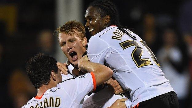 Fulham beat Bolton 4-0 to move above them in the Championship.