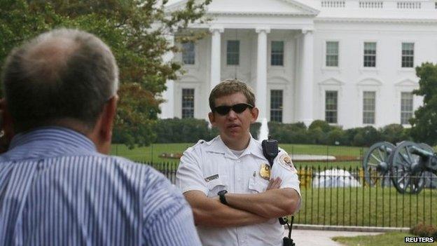 US Secret Service Uniformed Division officer tells a visitor that they cannot enter Lafayette Park or approach the White House during the visit of Israel's Prime Minister Benjamin Netanyahu in Washington 1 October 2014