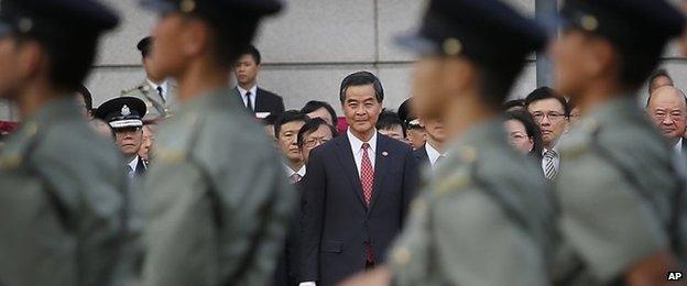 Hong Kong Chief Executive CY Leung watches a military parade (1 Oct 2014)