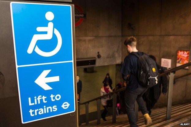 Sign at top of Westminster tube station reads "Lift to Trains"