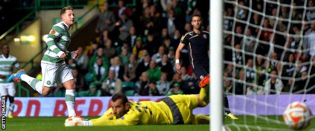 Kris Commons looks on as his early shot finds the corner of the net