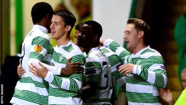 Celtic celebrate an early goal from Kris Commons (right)