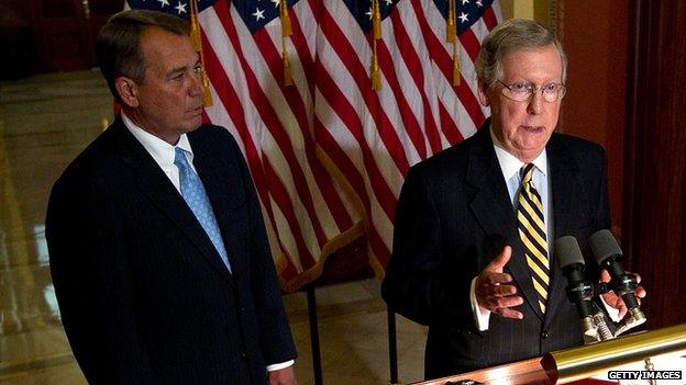 House Speaker John Boehner watches as Senate Minority Leader Mitch McConnell speaks.