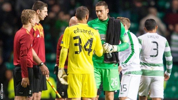 Goalkeepers Eduardo and Craig Gordon shake hands after the game at Celtic Park