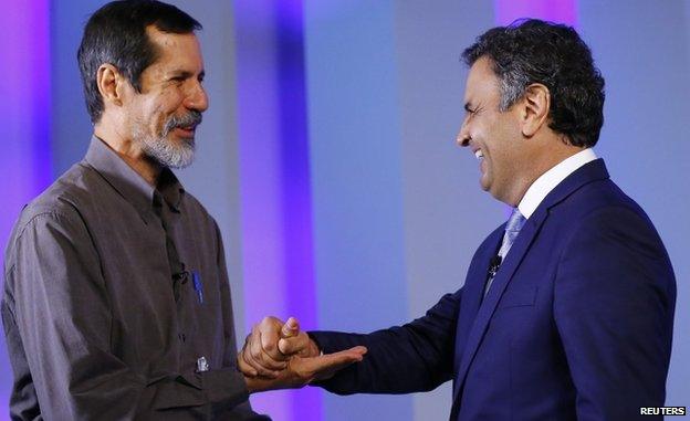 Green Party candidate Eduardo Jorge (left) greets Aecio Neves of the Brazilian Social Democratic Party as they take part in a TV debate in Rio de Janeiro on 2 October 2014.