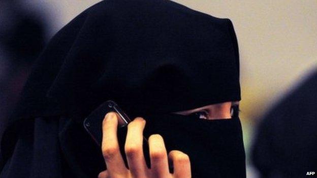 A woman wearing a burka talks on a mobile phone in Sydney. Photo: July 2011