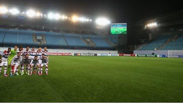 Bayern Munich line up for a team photo inside an empty CSKA Moscow Stadium