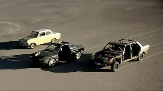 The cars driving across the Makgadikgadi salt pans