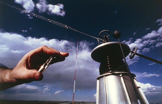 Caesium in a vial being held in front of a time station