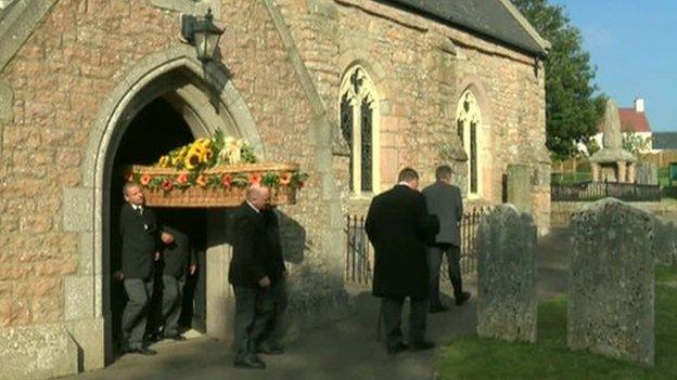 David Miller's wicker coffin was adorned with sunflowers