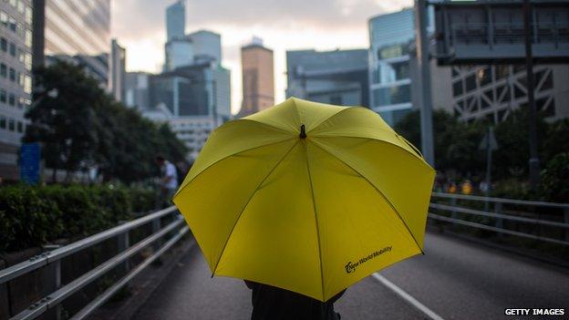 A protester carries an umbrella in Hong Kong