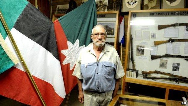 South African Afrikaner curator of Orania Museum, Gideon de Kock poses on 17 April 2013 in Orania