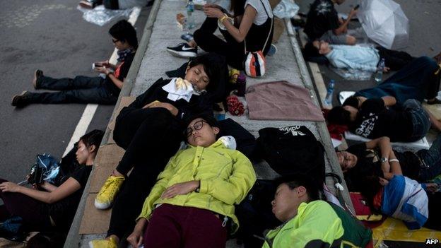 Pro-democracy protesters rest next to the central government offices in Hong Kong. Photo: 4 October 2014