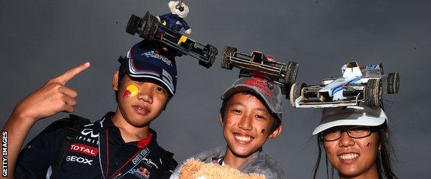 Fans show off their hats at the Japanese Grand Prix