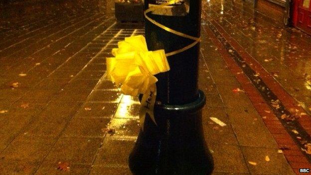 Yellow ribbons tied to a lamppost in Eccles, Salford