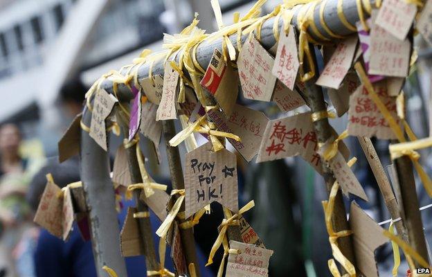 A cluster of signs with prayers and messages in Hong Kong on 30 September 2014