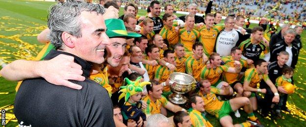 Jim McGuinness celebrates with his Donegal team after their win over Mayo in the All-Ireland football final in September 2012