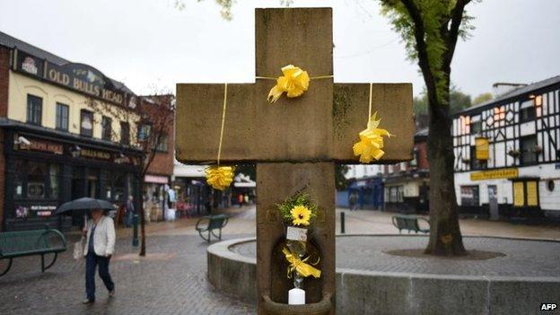 Floral tributes on the Eccles Cross