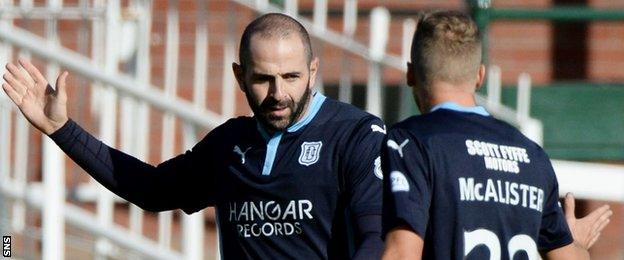 Gary Harkins is congratulated by Dundee team-mate Jim McAlister