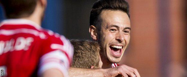 Andrew Considine celebrates after opening the scoring