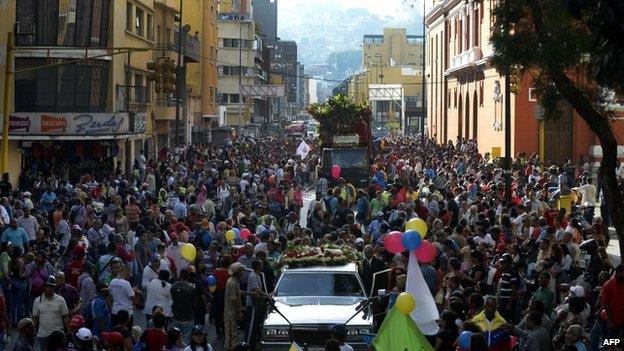 Thousands of people accompanied the coffins through the streets of Caracas, 4 Oct 14