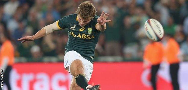 Patrick Lambie of South Africa kicks the match-winning penalty