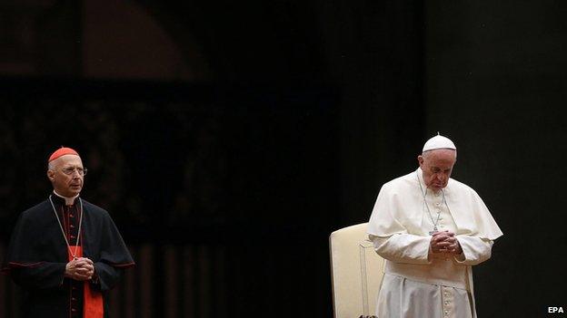 Pope Francis with cardinal Angelo Bagnasco (left) at the prayer vigil ahead of the synod.