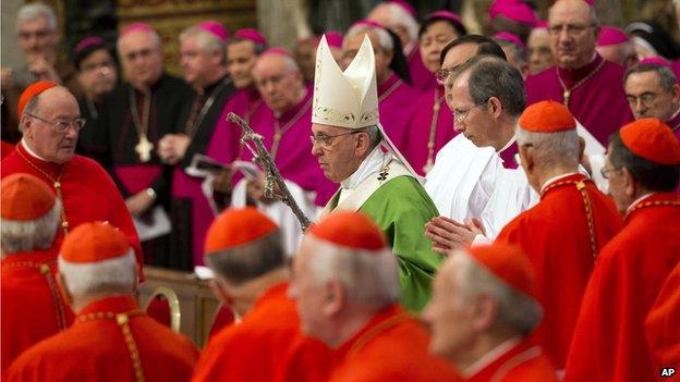 Pope Francis arrives to celebrate a mass in St. Peter's Basilica at the Vatican, Sunday, Oct. 5, 2014