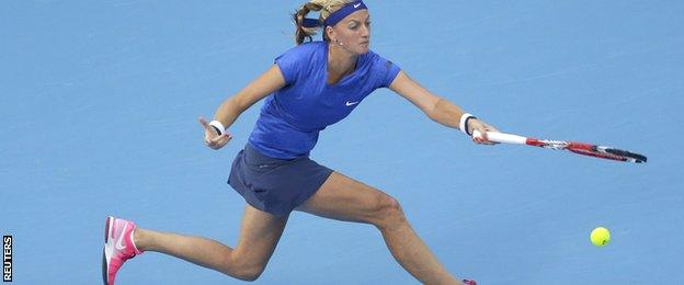 Petra Kvitova reaches for a forehand against Maria Sharapova