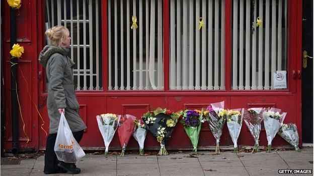 Floral tributes at Alan Henning's minicab office