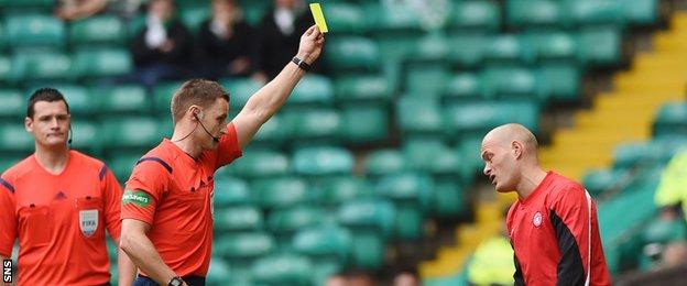 Hamilton Academical player-manager Alex Neil is booked by referee Steven McLean