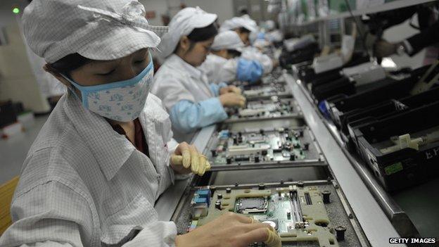 This photo taken on 27 May, 2013 shows Chinese workers in a factory in Shenzhen, in southern China's Guangdong province