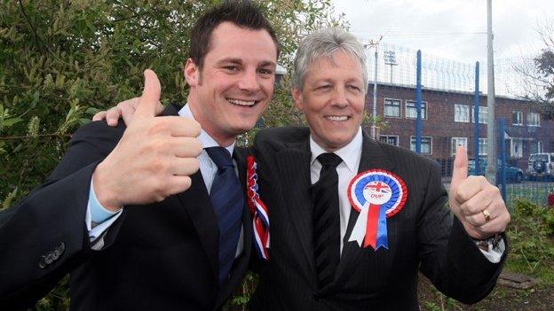 Peter Robinson (right) insists there was no conflict of interest with a boxing match it is claimed his son (left) helped promote